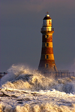 Waves Crashing Against A Lighthouse, Tyne And Wear, England