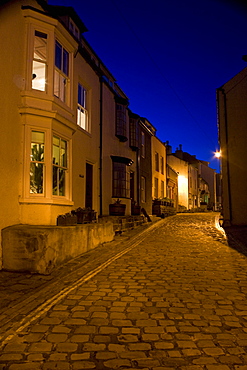 Narrow Cobblestone Road At Night