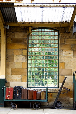 Suitcases On A Luggage Trolley In A Train Station