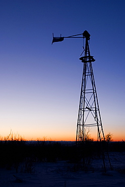 Alberta, Canada, Old Wind Mill At Sunset