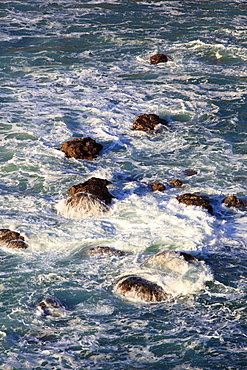 Oregon, United States Of America, Water Splashing On The Rocks Along The Coast Of The Pacific Ocean