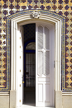 Chiclana, Andalusia, Spain, A White Door In A Colorful Wall