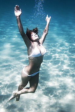 A Woman Floating Underwater, Tarifa, Cadiz, Andalusia, Spain