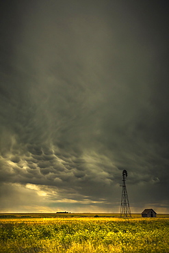 Mammatus storm clouds above a windmill on the saskatchewan prairies, Saskatchewan, canada