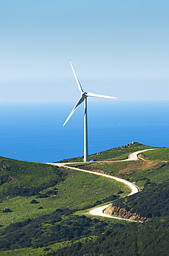 A wind turbine along the water's edge, Tarifa cadiz andalusia spain