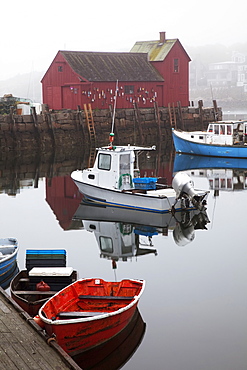 New England, Massachusetts, Close Up Of Small Boats In The Rockport Harbor, Red Building In Background.