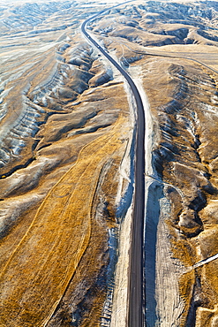 Aerial View Of A Road Through A Rugged, Barren Landscape, Cappadocia, Turkey