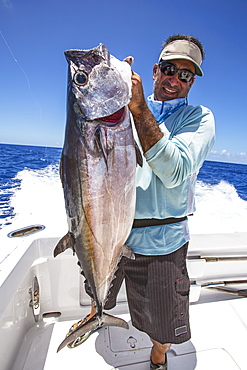 Fisherman Holding Dogtooth Tuna (Gymnosarda Unicolor), Tahiti