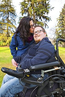 Disabled Husband With His Wife In A Park In Autumn, Edmonton, Alberta, Canada