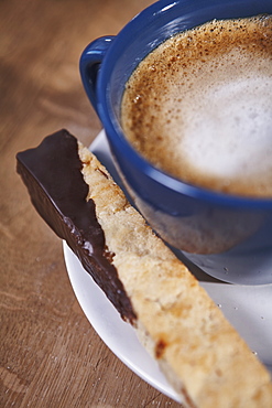 Cappuccino And Chocolate Dipped Biscotti On A White Plate, Ontario, Canada