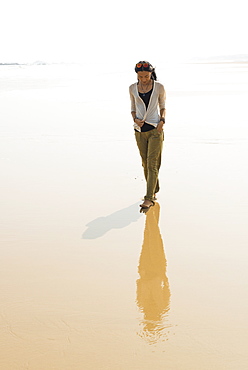 Young Woman Walking On The Beach From Huohu, North Of Kinmen Island, Taiwan