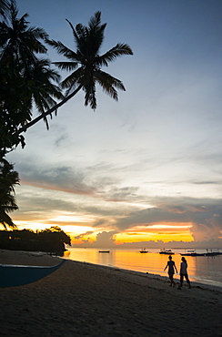 Beautiful Sunrise In Alona Beach, Friends Walking On The Sand, Panglao Island, Bohol, Philippines