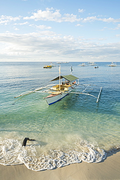 Boats On The Crystal Waters Of Alona Beach, Panglao Island, Bohol, Philippines