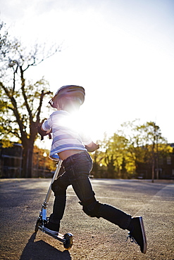 Young Boy Riding A Scooter, Montreal, Quebec, Canada