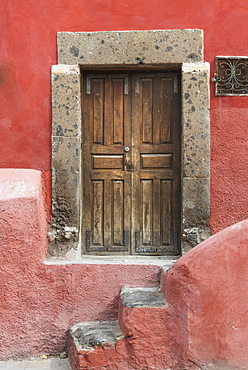 Worn Wooden Doors On A Red Painted Building, San Miguel De Allende, Guanajuato, Mexico