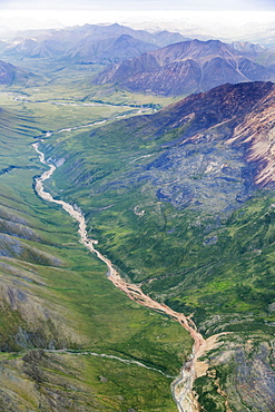 Aerial View Of A River Cutting Through A Valley In The Brooks Range, Alaska, United States Of America