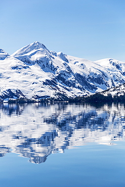 Snow Covered Mountains Reflect In The Calm Waters Of Prince William Sound In Winter, Kings Bay, Alaska, United States Of America