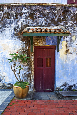 A Faded Red Door Sits Surrounded By A Weathered Blue Wall In Downtown Georgetown, Georgetown, Penang, Malaysia