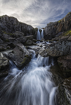 Stream Flows Over A Waterfall Along The Eastern Coast Of Iceland, Iceland