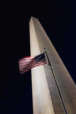 The American Flag Flies In A Stiff Wind At The Washington Monument, Washington, District Of Columbia, United States Of America