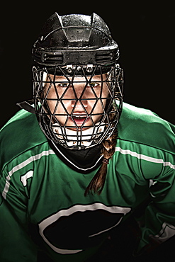 Ringette Player Wearing Green Jersey With Helmet And Cage, Regina, Saskatchewan, Canada