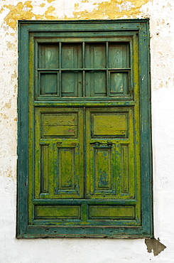 Weathered Green Wooden Window With Light Green Shutters In Weathered White Stucco Wall, Lanzarote, Canary Islands, Spain