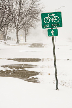 A Bike Route Sign In A Blizzard, Grand Forks, North Dakota, United States Of America