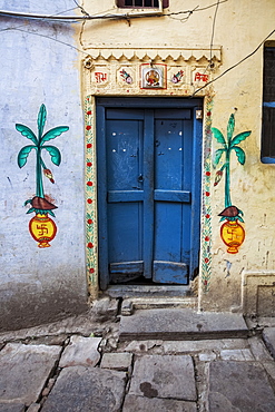 A Door To A Home Painted With Local Hindu Motifs, Including Hindu Swastikas, Varanasi, India