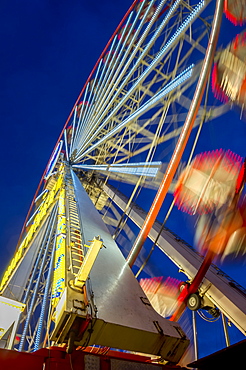 Low Angle View Of A Colourful Ferris Wheel In Motion, Newcastle Upon Tyne, Tyne And Wear, England