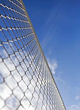 Low Angle View Of A Volleyball Net Against A Blue Sky With Cloud, Honolulu, Oahu, Hawaii, United States Of America