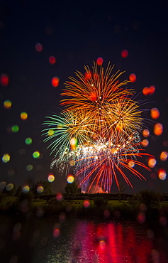 Colourful Fireworks Display Reflected In Water On Canada Day, Edmonton, Alberta, Canada