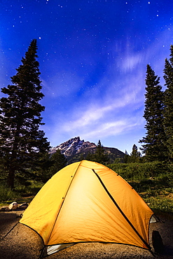 Tent And Milky Way Visible In The Sky Over Teton Range, Grand Teton National Park, Wyoming, United States Of America