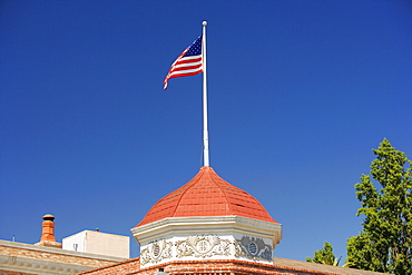 High section view of a building with an American flag on the top of it