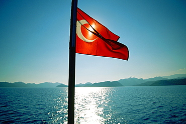 Close-up of a Turkish flag fluttering on a cruise ship, Kekova, Antalya, Turkey