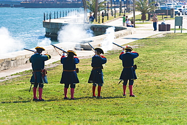 Rear view of four people shooting rifles, St. Augustine, Florida, USA