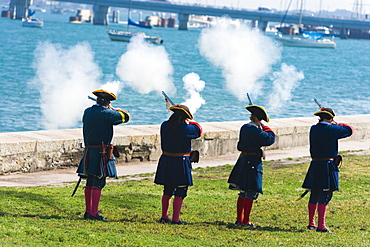 Rear view of four people shooting rifles, St. Augustine, Florida, USA