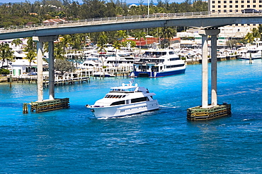 Cruise ship under a bridge in the sea, Western Bridge, Paradise Island, Bahamas