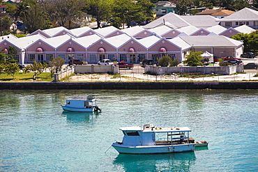 Tourboats in water in front of buildings, Paradise Island, Bahamas