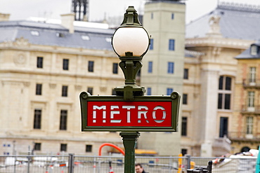 Signboard on a lamppost with buildings in the background, Paris, France