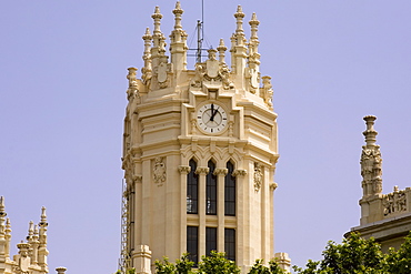 Low angle view of a clock tower, Palacio De Comunicaciones, Plaza de Cibeles, Madrid, Spain