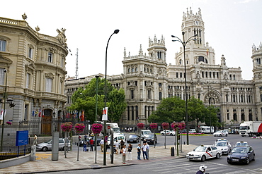 Traffic on a road in front of a palace, Palacio de Linares, Palacio De Comunicaciones, Plaza de Cibeles, Madrid, Spain