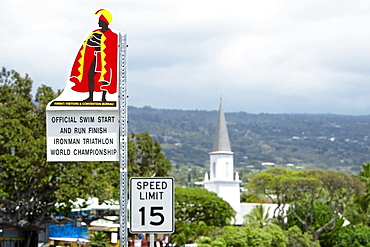 Speed limit signboard with a church in the background, Mokuaikaua Church, Kailua-Kona, Kona, Big Island, Hawaii Islands, USA