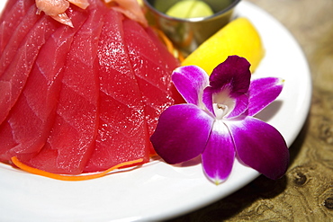 Close-up of raw fish slices in a plate