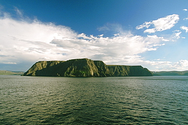 Clouds over a cliff at the waterfront, North Cape, Skarsvag, Norway