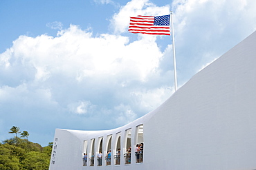 Low angle view of an American flag fluttering on a memorial building, USS Arizona Memorial, Pearl Harbor, Honolulu, Oahu, Hawaii Islands, USA