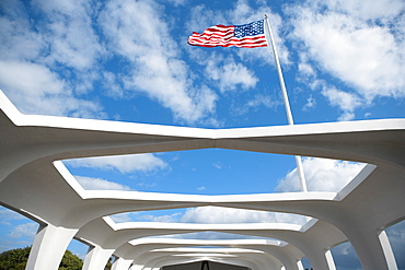 Low angle view of an American flag fluttering on a memorial building, USS Arizona Memorial, Pearl Harbor, Honolulu, Oahu, Hawaii Islands, USA