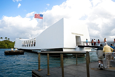 American flag fluttering on a memorial building, USS Arizona Memorial, Pearl Harbor, Honolulu, Oahu, Hawaii Islands, USA