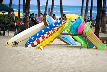 Surfboards and pool rafts on the beach, Waikiki Beach, Honolulu, Oahu, Hawaii Islands, USA