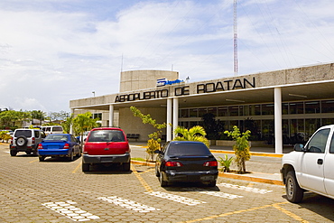 Cars parked in front of an airport entrance, Roatan, Bay Islands, Honduras