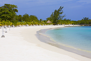 Lounge chairs on the beach, Coral Cay, Dixon Cove, Roatan, Bay Islands, Honduras